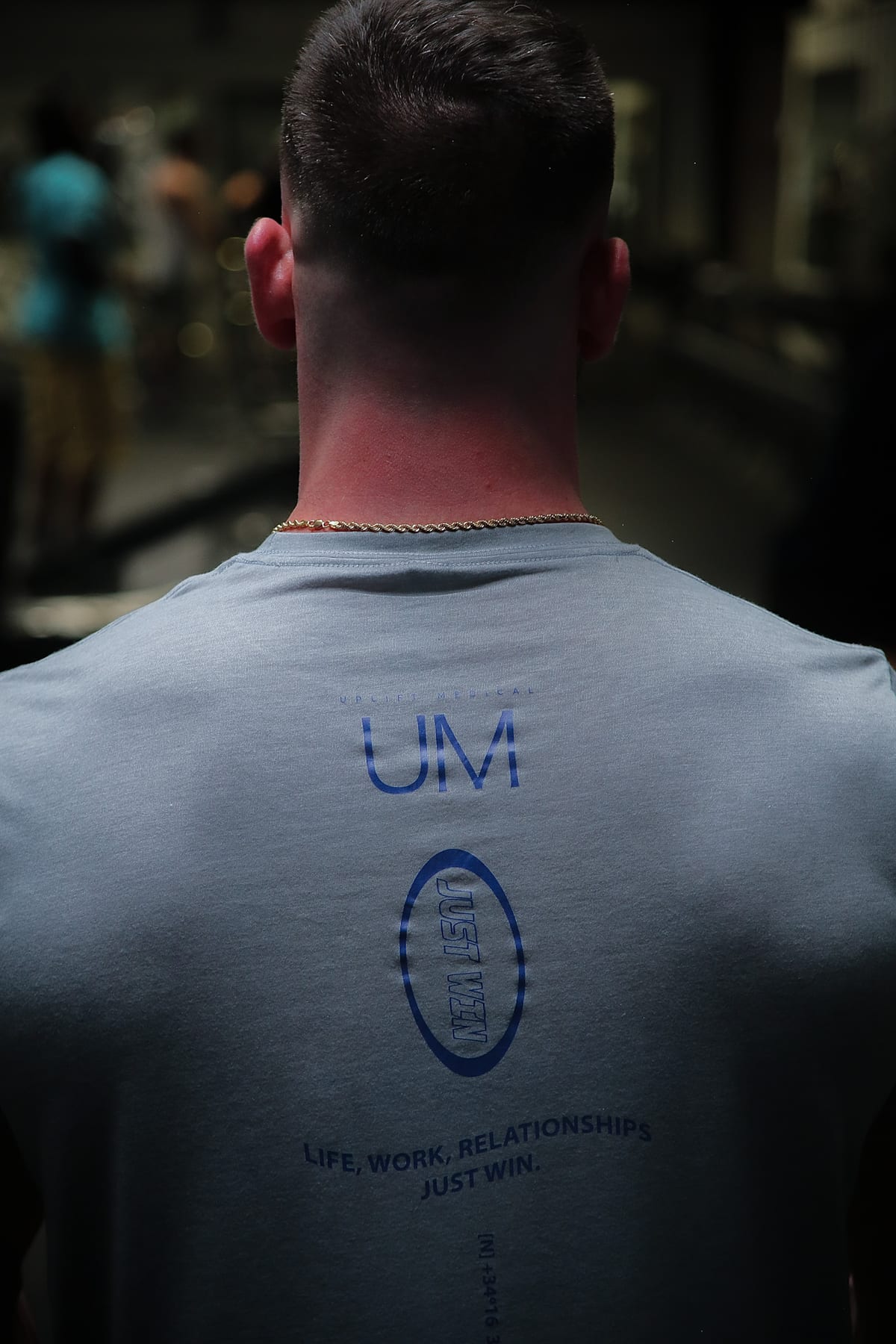 Person wearing an Uplift Medical shirt at the gym